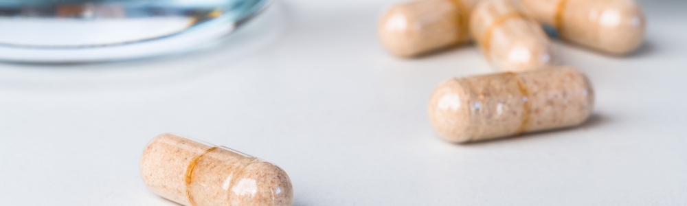 Fiber supplements lying on white counter top 
